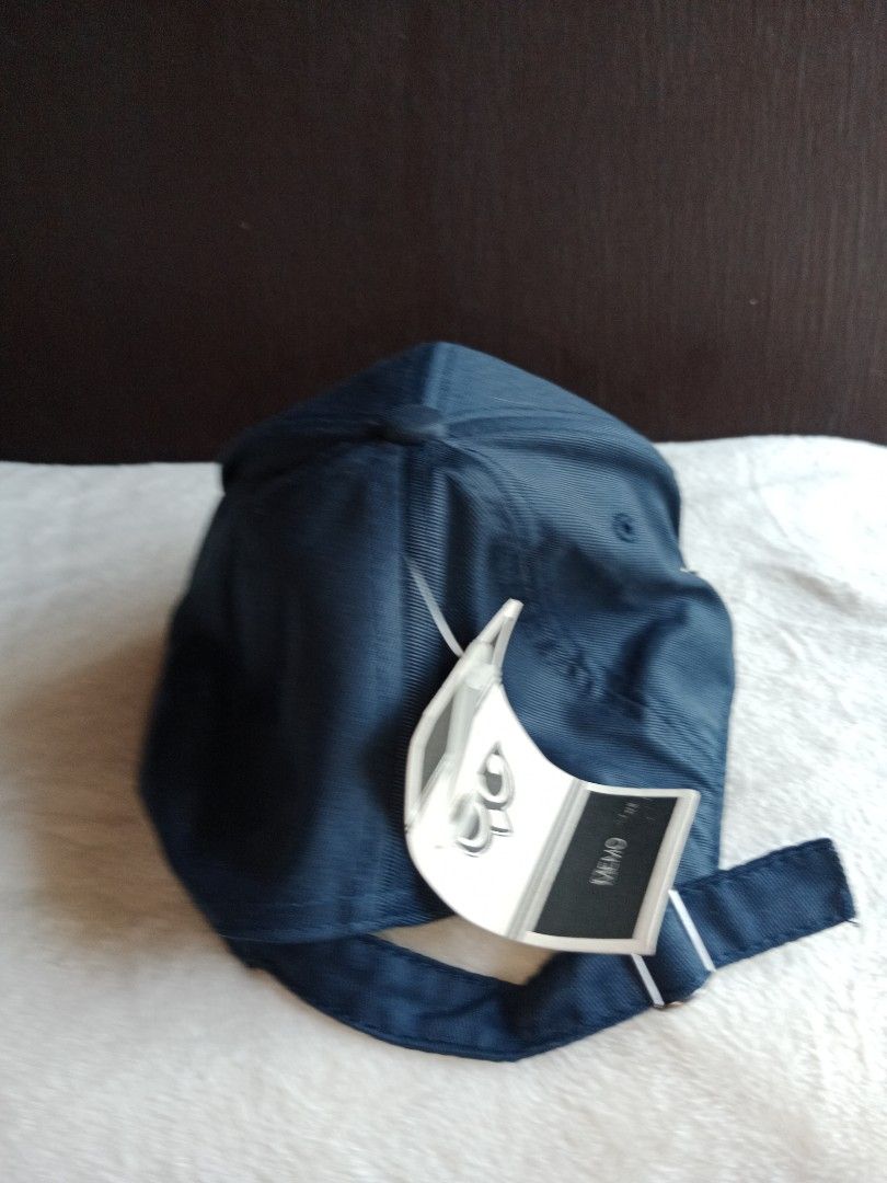 Dark Blue Cap with Metal Accents (Category: Caps & Hats) located in Manila. Submitted by angeloarce64172 (Listing ID 1440230896, Image 3). Description: - Dark blue baseball cap - Features cool metal details on the side and back - Adjustable strap for a perfect fit - Brand new with tags still attached - Ideal for casual outings or sports activities.