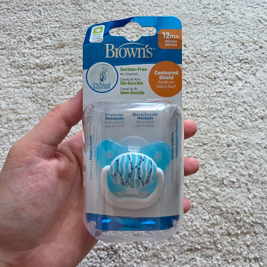 Dr Brown's Prevent Pacifier 12m+ Silicone Blue (Category: Soothers & Pacifiers) located in Mandaluyong City. Submitted by beaorselena (Listing ID 1440352109, Image 1). Description: - Brown's Prevent Pacifier - For babies 12 months and older - Blue color with wave pattern - Suction-free air channel for comfort - Contoured shield is gentle on baby's face - Made of soft silicone - Comes in original packaging.
