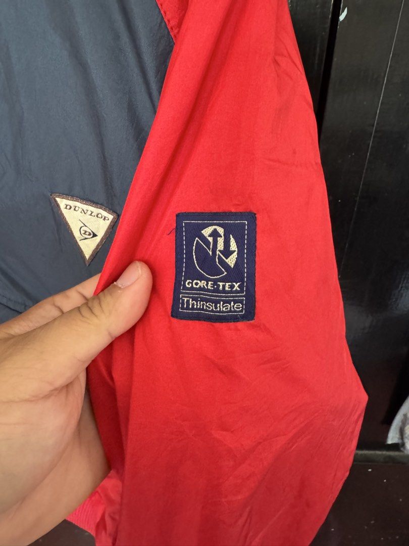 Dunlop Gore-Tex Thinsulate Anorak Windbreaker Jacket (Category: Coats, Jackets and Outerwear) located in Antipolo. Submitted by knez05 (Listing ID 1440222373, Image 2). Description: - Brand: Dunlop - Technology: Gore-Tex and Thinsulate for warmth and water resistance - Color: Red and Navy Blue - Style: Anorak windbreaker - Features: Hooded design, quarter-zip closure with snap buttons, large front pocket - Ideal for: Outdoor activities and casual
