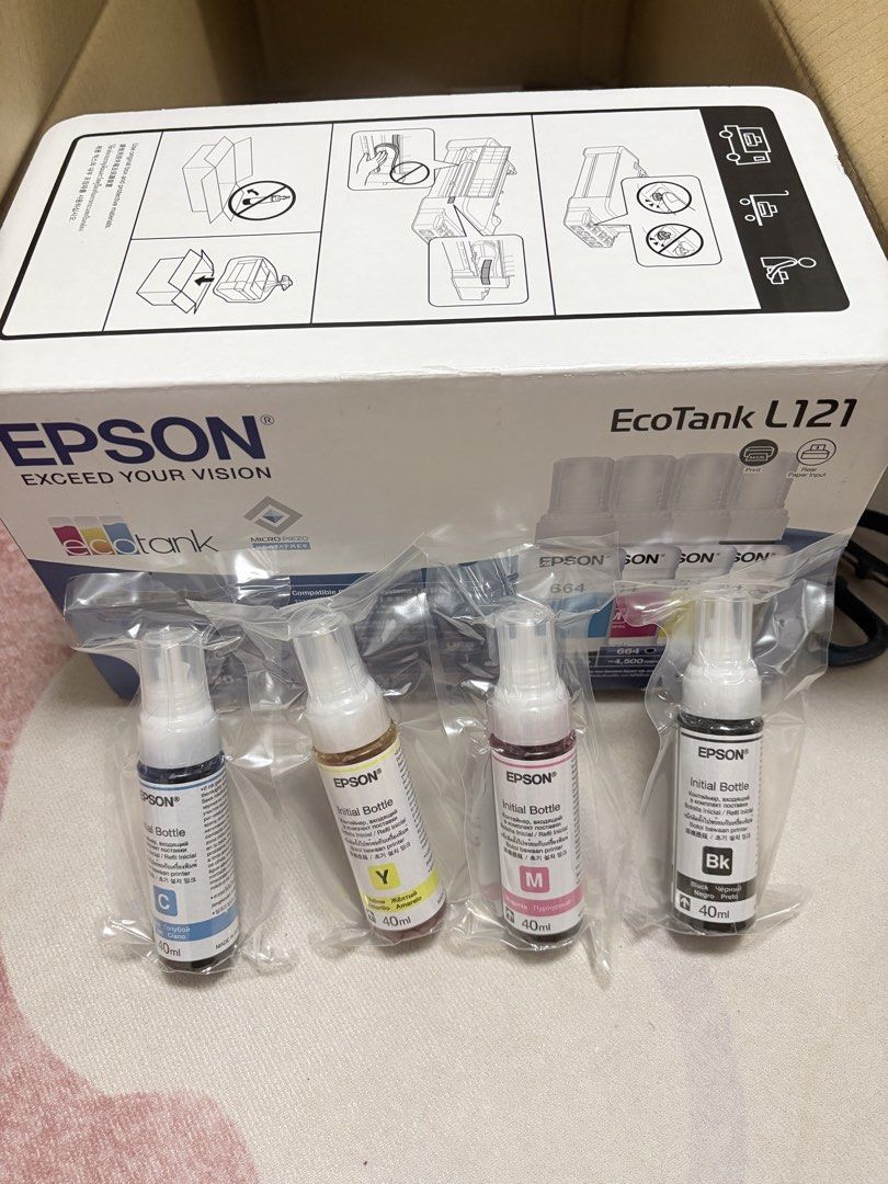 Epson EcoTank L121 664 CMYK Inks (Category: Printers, Scanners & Copiers) located in Imus. Submitted by hello.declutter.ph (Listing ID 1440312202, Image 1). Description: - Genuine starter ink set for Epson EcoTank L121 printer - Includes all four colors: Cyan (C), Yellow (Y), Magenta (M), Black (Bk) - Each bottle contains 40ml of ink - These are the original inks that come with the printer - Brand new, unopened, and factory sealed.