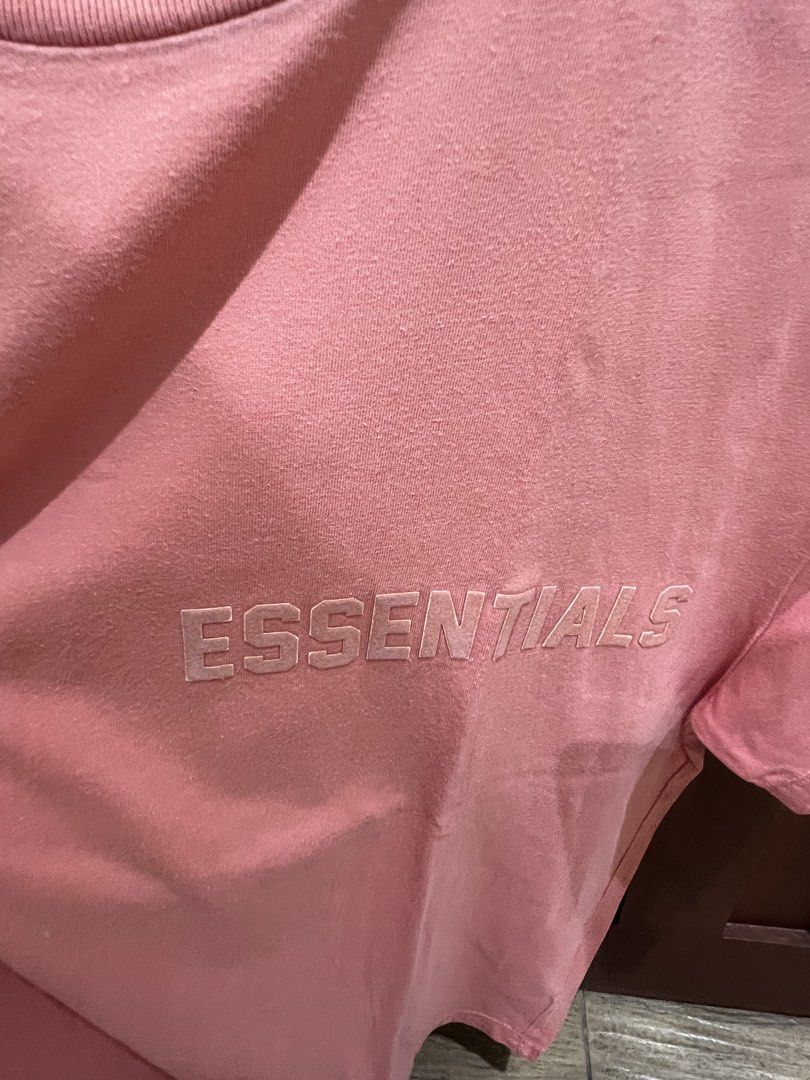 Fear of God Essentials T-Shirt Coral Pink Size S (Category: Tshirts & Polo Shirts ) located in Manila. Submitted by thejenclai01765 (Listing ID 1440360801, Image 3). Description: - Coral pink Fear of God Essentials t-shirt - Classic embossed 'Essentials' logo on the chest - Short sleeves - Comfortable fit - Size S - Ideal for casual wear.