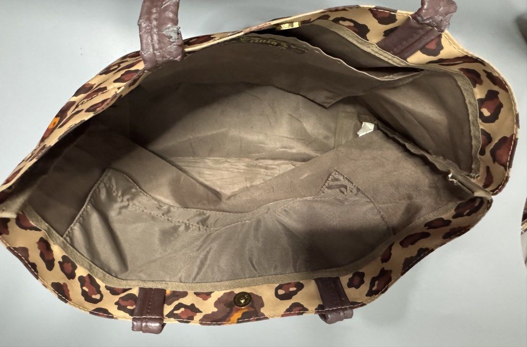 FEILER Leopard Print Tote Bag (Category: Tote Bags) located in Bacoor. Submitted by curatedbylois (Listing ID 1440266815, Image 3). Description: Pre-owned and in good condition - Brand: FEILER - Design: Leopard print - Material: Canvas with leather handles - Features: 2 interior pockets for organization Note: -with minimal crackings on the handle.