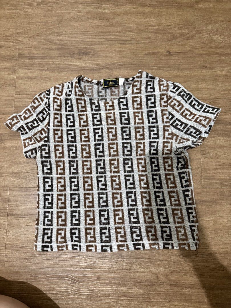 Fendi Zucca Pattern T-Shirt (Category: Shirts) located in Mandaluyong City. Submitted by gemmiebears (Listing ID 1440281337, Image 1). Description: - Iconic Fendi Zucca pattern t-shirt - Size: 42 - Short sleeves - Material: 80% Cotton, 20% Polyamide - Made in Italy - Ideal for Fendi enthusiasts and collectors.