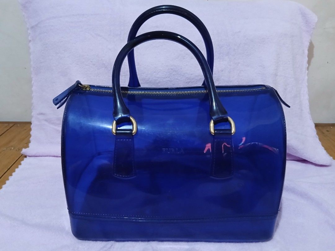 Furla Candy Satchel Handbag (Category: Luxury Bags & Wallets) located in Bocaue. Submitted by jennicakes.2.0 (Listing ID 1440260298, Image 1). Description: Furla Candy Satchel Handbag ✓ Blue transparent Furla Handbag ✓ Zipper closure ✓ Top handles ✓ Ideal for everyday use or a pop of color 💷Mode of Payment 💜 Maya 🩷 GoTyme 🤎GCash 📦 Mode of Delivery Standard - J&T Delivery Same Day - Lalamove.