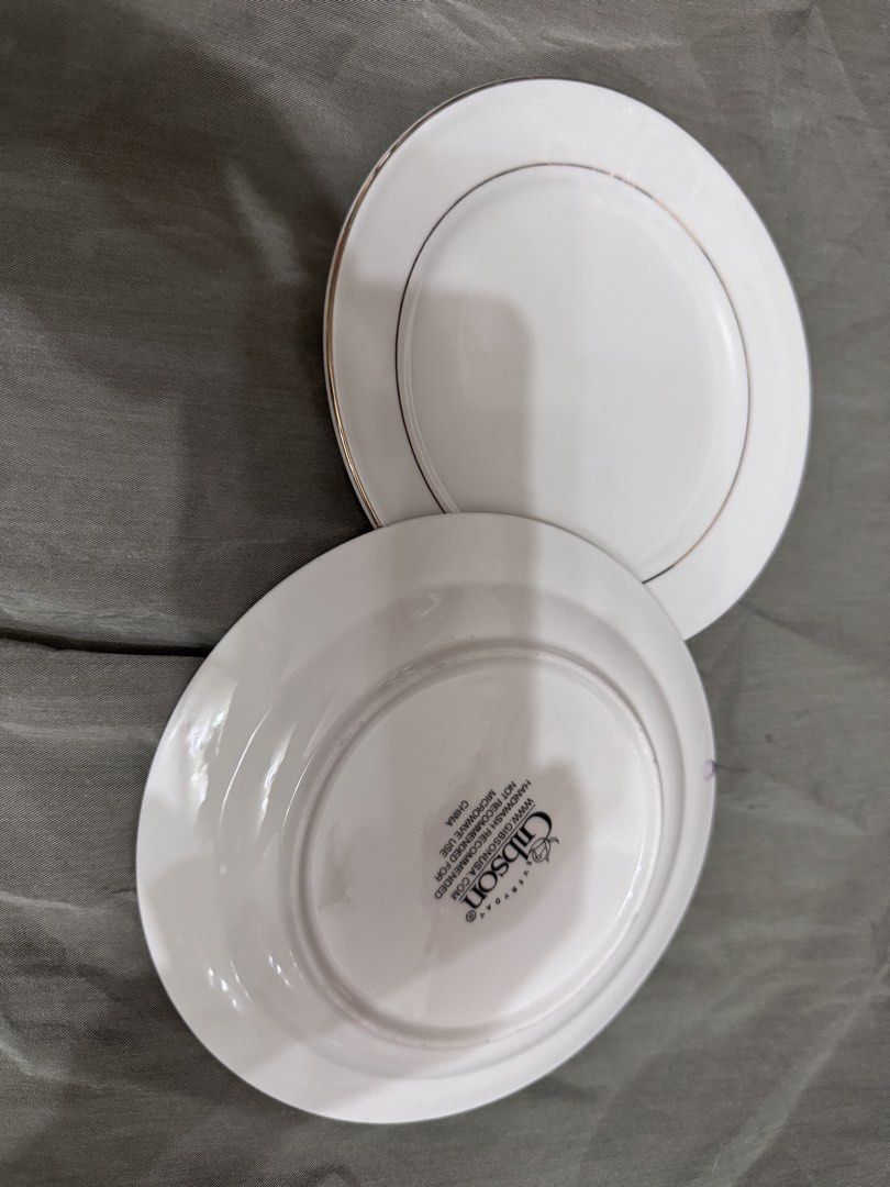 Gibson Dinnerware Cake Plate with Gold Rim (Category: Dinnerware & Cutlery) located in Marikina City. Submitted by lorradel (Listing ID 1440318879, Image 1). Description: - Gibson white dinner plate - Features a thin gold rim - Backstamp includes Gibson logo and care instructions - Care: Handwash recommended, but also dishwasher and microwave safe - Ideal for everyday use or special occasions - surplus because of the backpaint, factory defect.