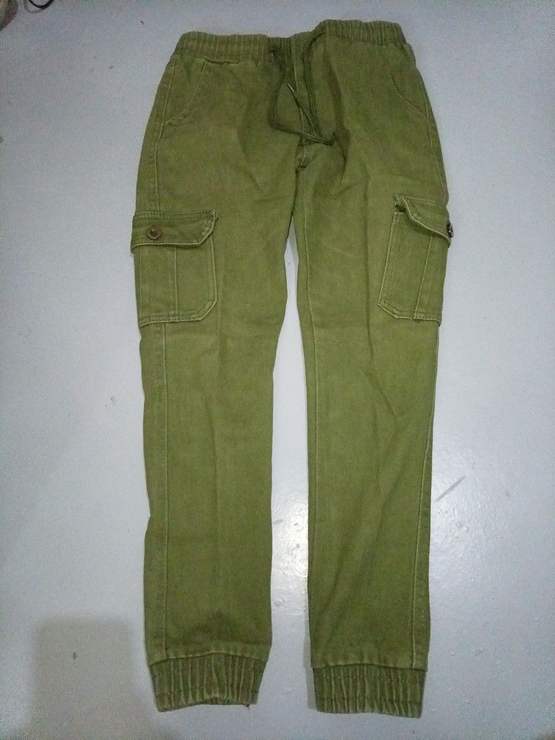 Green Cargo Pants with Elastic Waistband and Drawstring (Category: Other Bottoms) located in Manila. Submitted by brightfire_476 (Listing ID 1440299818, Image 1). Description: - Olive green cargo pants - Comfortable elastic waistband with drawstring - Multiple front and back pockets - Jogger style with elastic cuffs - Ideal for casual outfits.