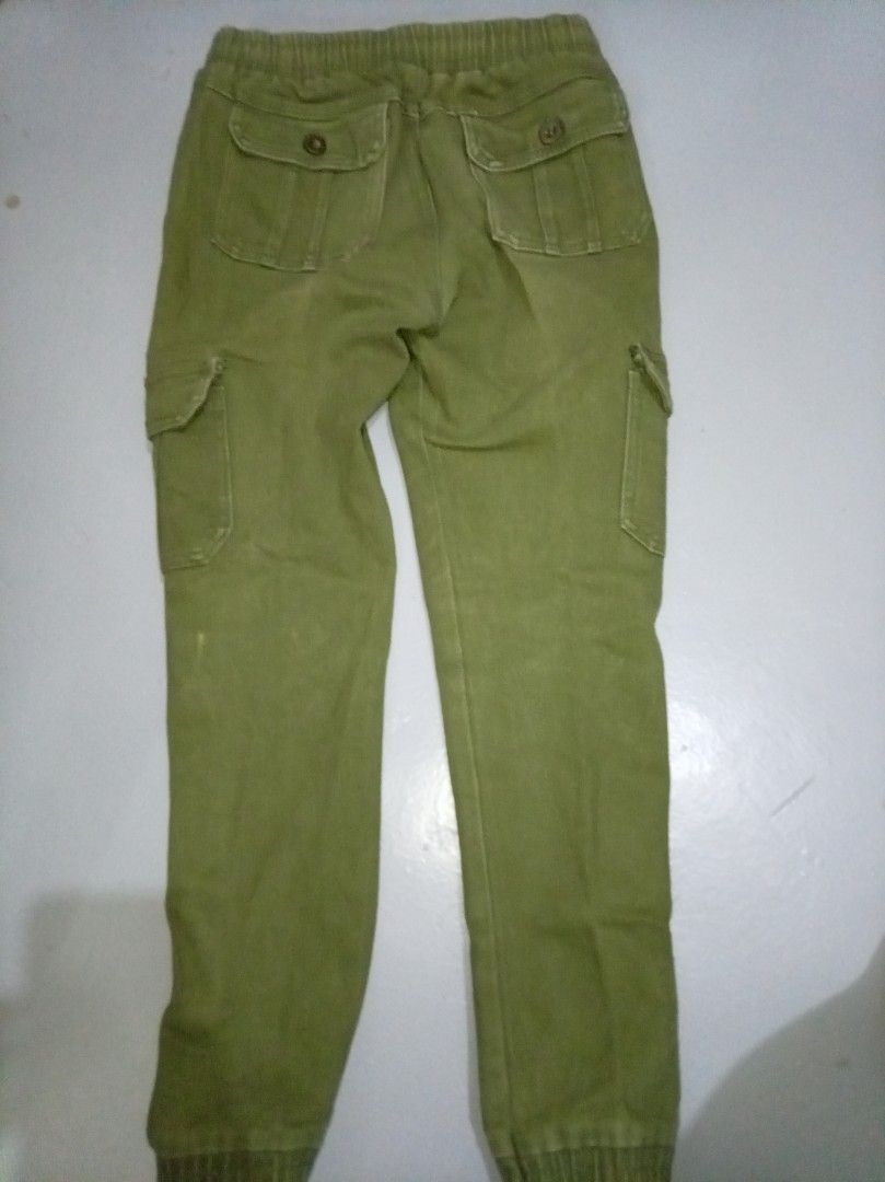 Green Cargo Pants with Elastic Waistband and Drawstring (Category: Other Bottoms) located in Manila. Submitted by brightfire_476 (Listing ID 1440299818, Image 2). Description: - Olive green cargo pants - Comfortable elastic waistband with drawstring - Multiple front and back pockets - Jogger style with elastic cuffs - Ideal for casual outfits.