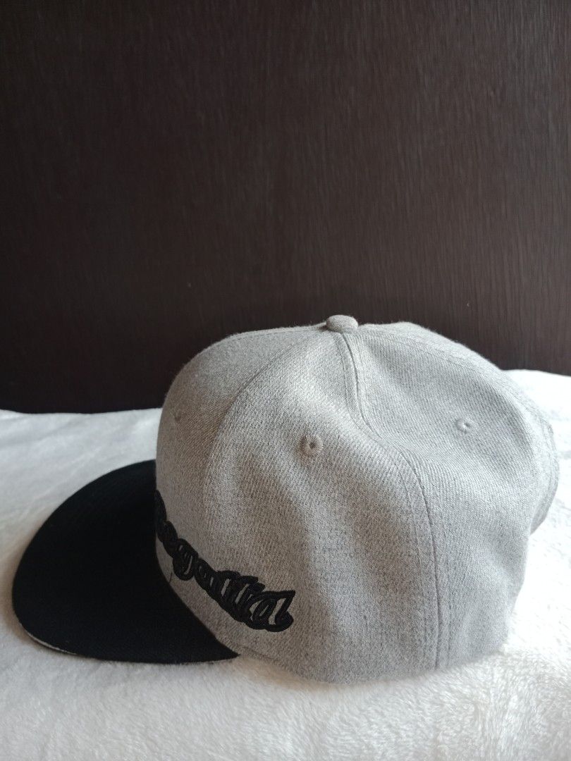 Grey and Black Snapback Cap with 'Regal' Embroidery (Category: Caps & Hats) located in Manila. Submitted by angeloarce64172 (Listing ID 1440250594, Image 3). Description: - Stylish snapback cap - Grey crown with black brim - 'Regal' embroidered in black on the side - Structured interior with adjustable snapback closure - Perfect for casual and urban style.