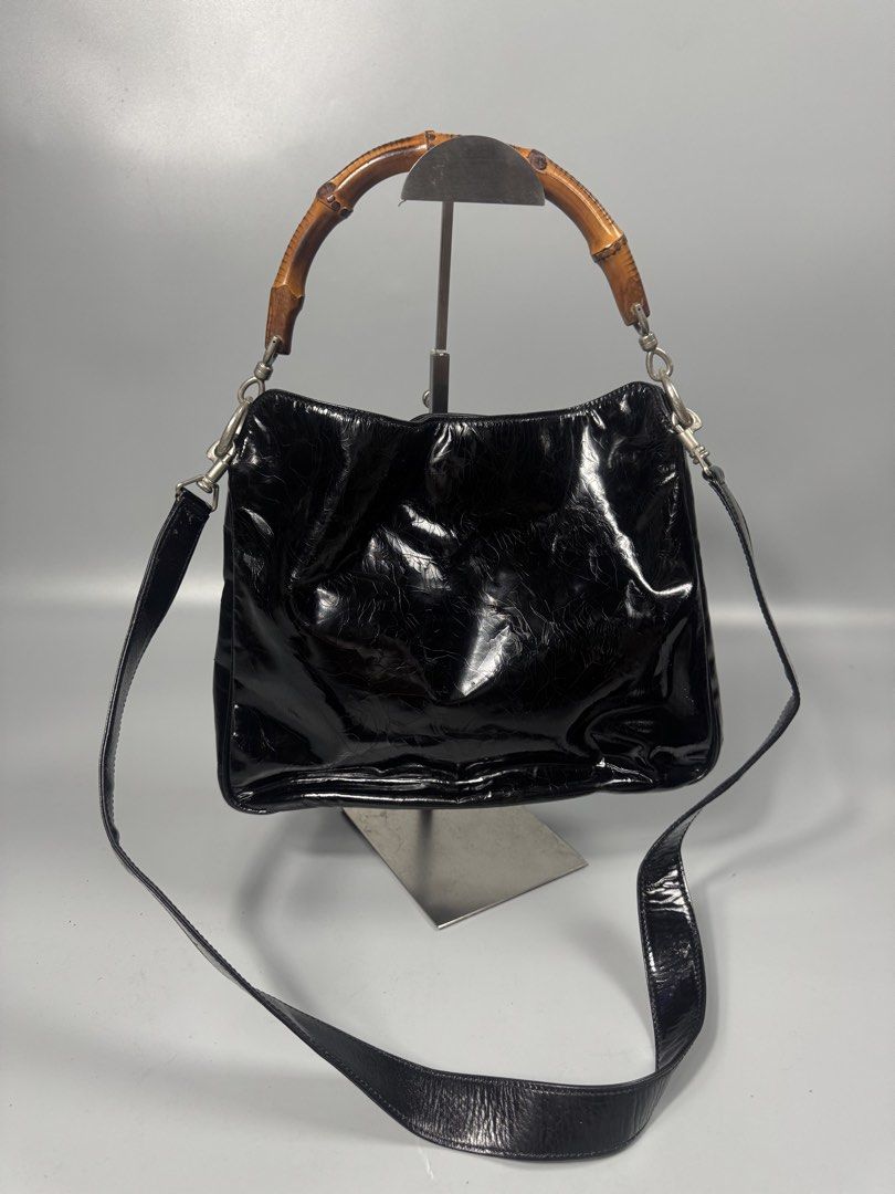 Gucci bambo handbag/crossbody (Category: Luxury Bags & Wallets) located in Quezon City. Submitted by streetgallerygarments (Listing ID 1440285725, Image 1). Description: vintage Gucci Bamboo Top Handle 2-Way Bag crafted in black patent leather / enamel finish, dating back to the late 1990s or early 2000s Tom Ford era.