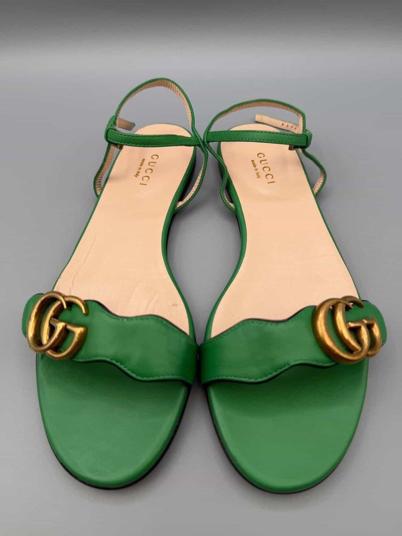 Gucci Green Leather Double G Sandals (Category: Flats & Sandals) located in Manila. Submitted by klowibaby (Listing ID 1440292543, Image 1). Description: - Authentic Gucci sandals in vibrant green - Features iconic Double G hardware - Genuine leather upper and sole - Secure ankle strap closure - Made in Italy - Size: 37.5 - Versatile for any outfit.
