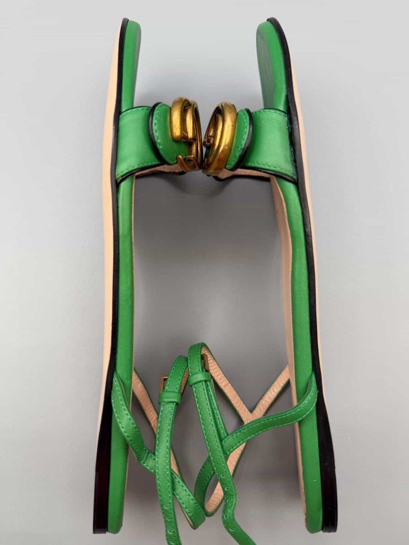 Gucci Green Leather Double G Sandals (Category: Flats & Sandals) located in Manila. Submitted by klowibaby (Listing ID 1440292543, Image 3). Description: - Authentic Gucci sandals in vibrant green - Features iconic Double G hardware - Genuine leather upper and sole - Secure ankle strap closure - Made in Italy - Size: 37.5 - Versatile for any outfit.