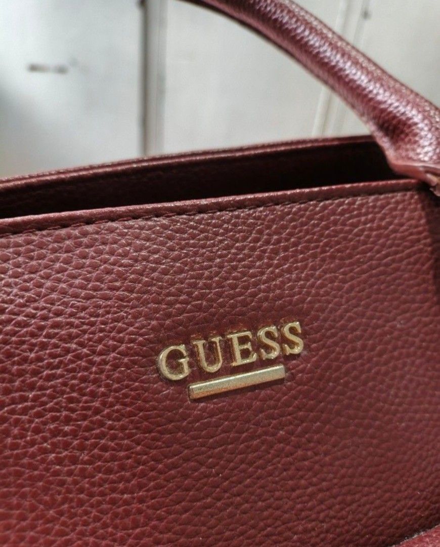 Guess Christa Wine Satchel Bag (Category: Luxury Bags & Wallets) located in Cainta. Submitted by sjprelovedbotique (Listing ID 1440383763, Image 2). Description: - Burgundy Guess Christa satchel bag - Front flap pocket with lock detail - Gold hardware - Interior Guess logo tag - Comes with original tag (style number & color) - Great everyday bag.