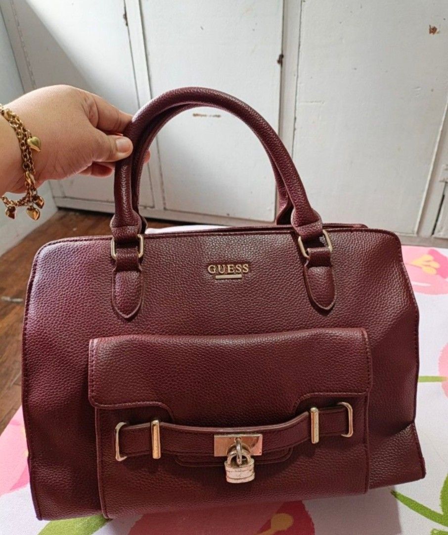 Guess Christa Wine Satchel Bag (Category: Luxury Bags & Wallets) located in Cainta. Submitted by sjprelovedbotique (Listing ID 1440383763, Image 1). Description: - Burgundy Guess Christa satchel bag - Front flap pocket with lock detail - Gold hardware - Interior Guess logo tag - Comes with original tag (style number & color) - Great everyday bag.