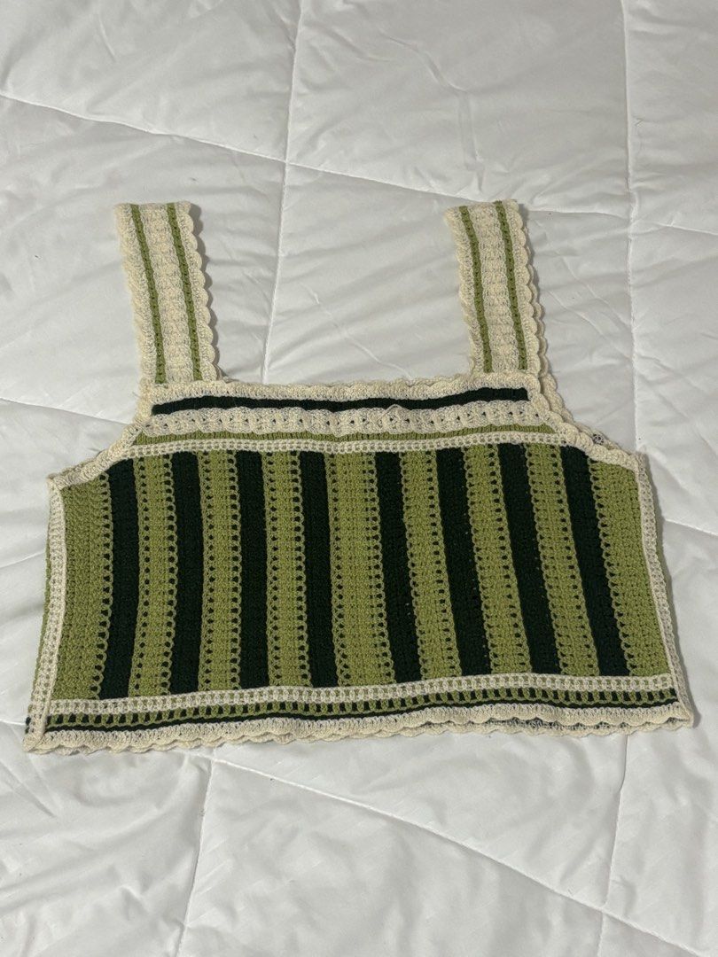 Handmade Crochet Crop Top Green Cream (Category: Sleeveless) located in Apalit. Submitted by carmelaregulto (Listing ID 1440320285, Image 2). Description: - Super cute handmade crochet crop top - Intricate green and cream patterns - Adjustable straps for a perfect fit - Unique, one-of-a-kind design - Ideal for festivals or casual summer wear.