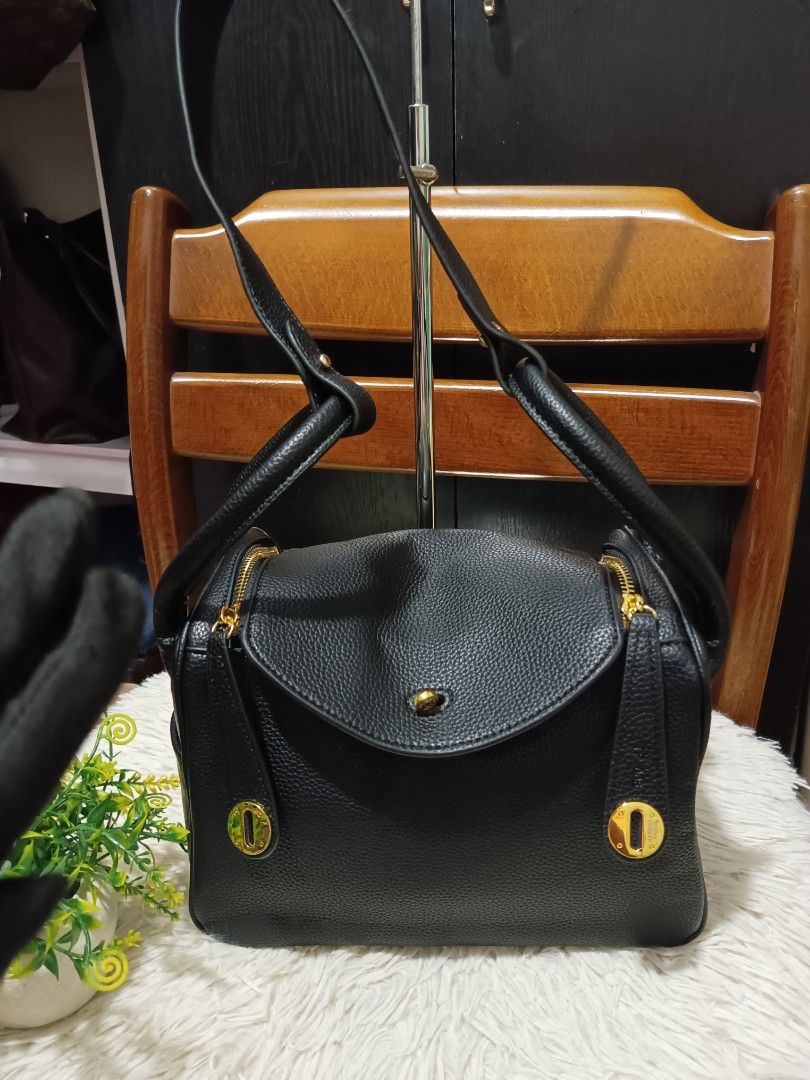 Hermes Black Leather Taurillon Clemence Lindy Bag (Category: Luxury Bags & Wallets) located in Digos. Submitted by chihanu (Listing ID 1440335913, Image 1). Description: - Genuine black Taurillon Clemence leather - Elegant gold hardware - Front flap closure with secure turn-lock - Versatile carrying options: two top handles and a detachable shoulder strap - Organized interior with multiple compartments - Pristine condition, clean inside and out -