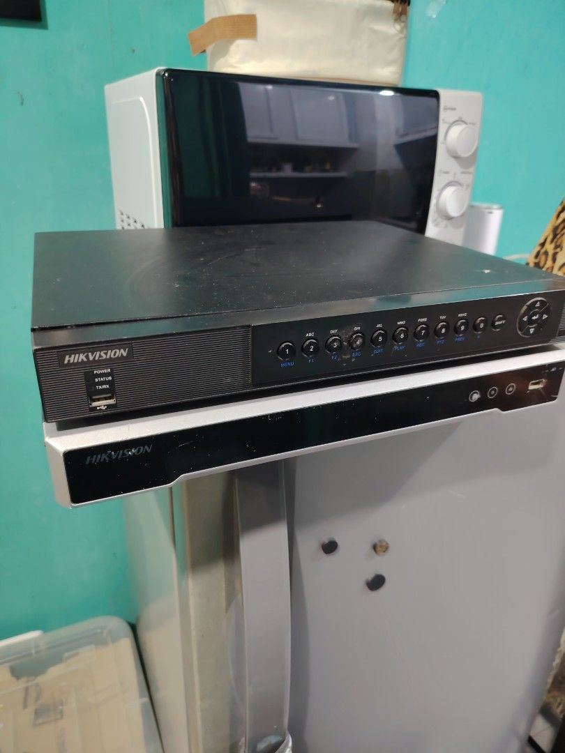 Hikvision DVR/NVR Security System Recorder (Category: Other Home Appliances) located in Manila. Submitted by lfg92 (Listing ID 1440319337, Image 2). Description: - Hikvision DVR/NVR unit - Supports multiple security camera inputs - Front panel indicators: Power, Status, HDD lights - Front USB port for convenience - Sleek black design - Perfect for home or business security systems.