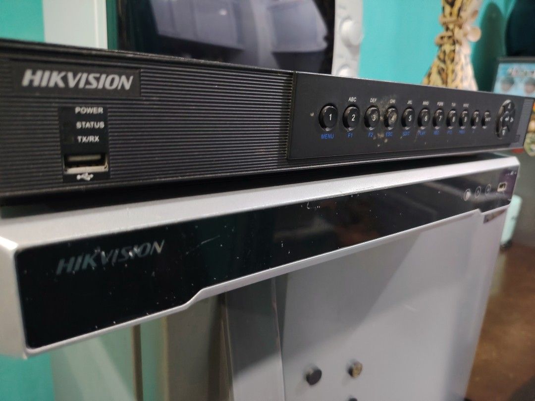 Hikvision DVR/NVR Security System Recorder (Category: Other Home Appliances) located in Manila. Submitted by lfg92 (Listing ID 1440319337, Image 1). Description: - Hikvision DVR/NVR unit - Supports multiple security camera inputs - Front panel indicators: Power, Status, HDD lights - Front USB port for convenience - Sleek black design - Perfect for home or business security systems.