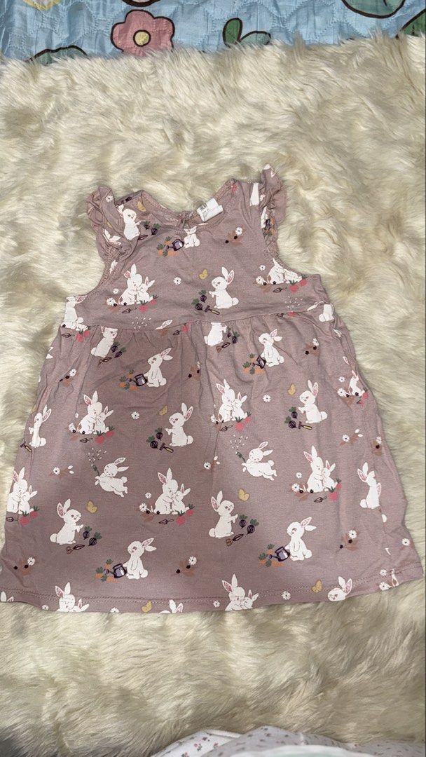 H&M Baby Girl Bunny Print Dress with Ruffle Sleeves (Category: Babies & Kids Fashion) located in Rizal. Submitted by cutiefindspreloveditems (Listing ID 1440368049, Image 2). Description: - Adorable H&M baby dress - Features a sweet all-over bunny print - Lovely dusty rose color - Cute ruffle sleeves - Convenient tie closure at the back - Made from soft, comfortable cotton - Ideal for spring occasions or Easter celebrations.