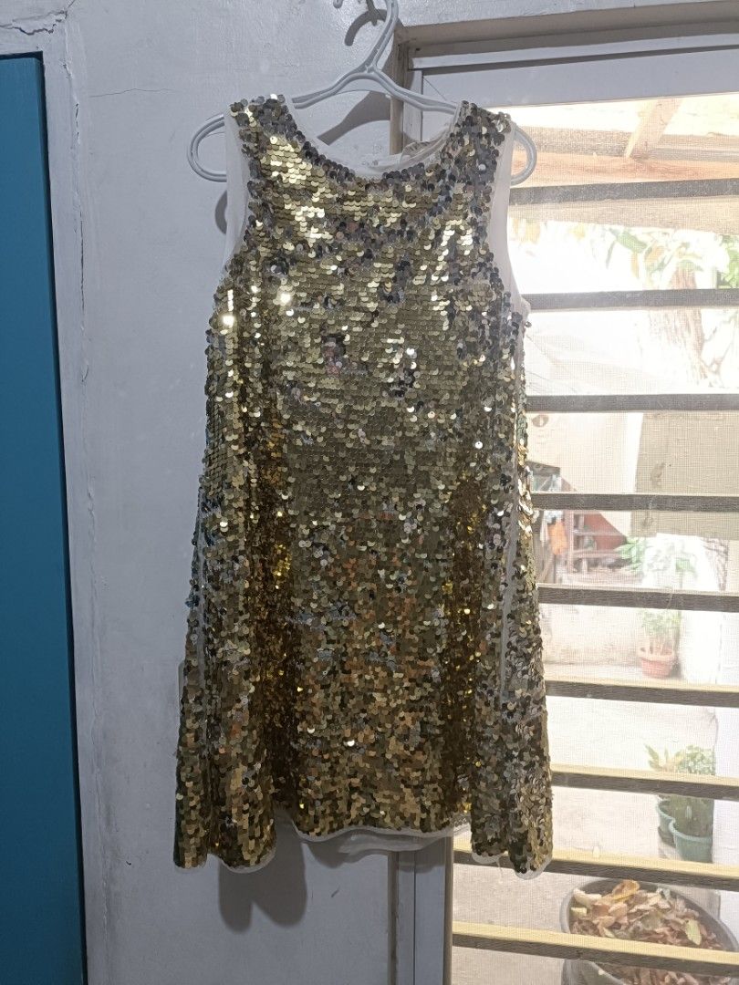 H&M Sequin Dress for Girls - Gold (Category: Babies & Kids Fashion) located in Antipolo. Submitted by keekaikeekoi (Listing ID 1440274240, Image 1). Description: - 8-9 years on tag but may also fit 4-7 years old.