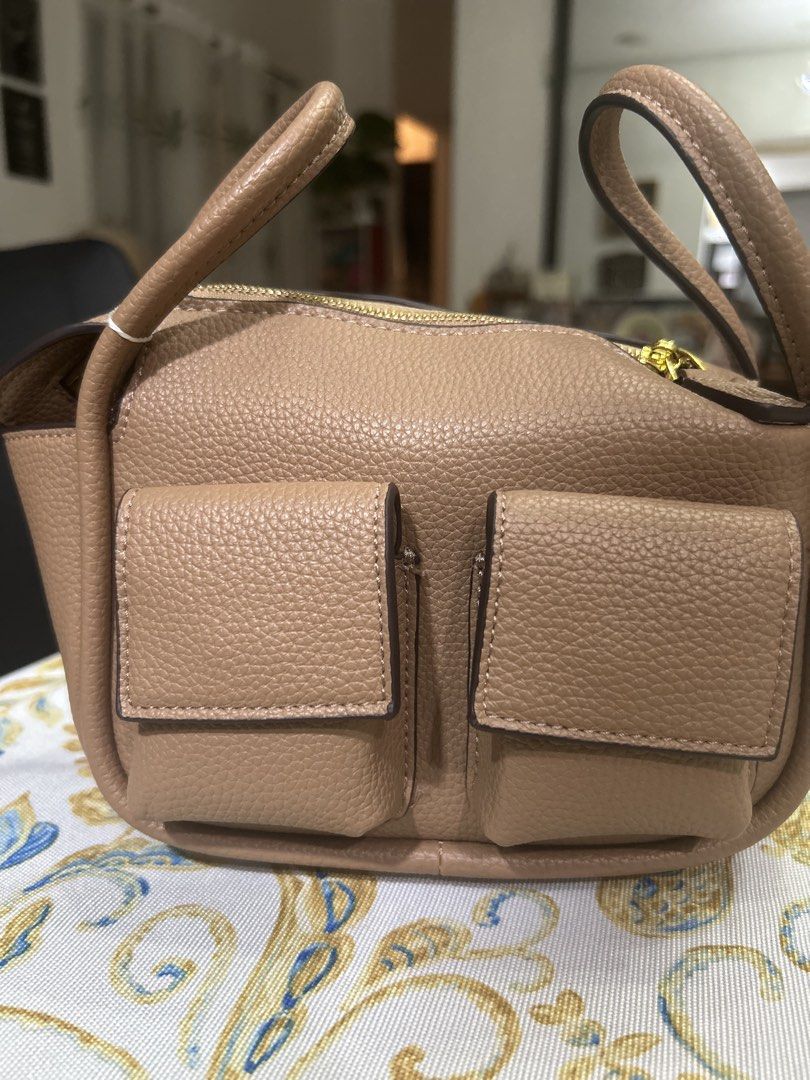 HOLB Mini Brick PU (Category: Luxury Bags & Wallets) located in Paranaque City. Submitted by jenggalorescloset (Listing ID 1440313324, Image 1). Description: House of Little Bunny (HOLB) Mini Bric: The authentic, highly sought-after Mini Bric model from the popular HOLB line. Premium PU Leather: Crafted from high-quality, durable textured PU leather that mimics a premium pebbled look. Chic Neutral Taupe: Timeless tan/taupe colorway that easily co