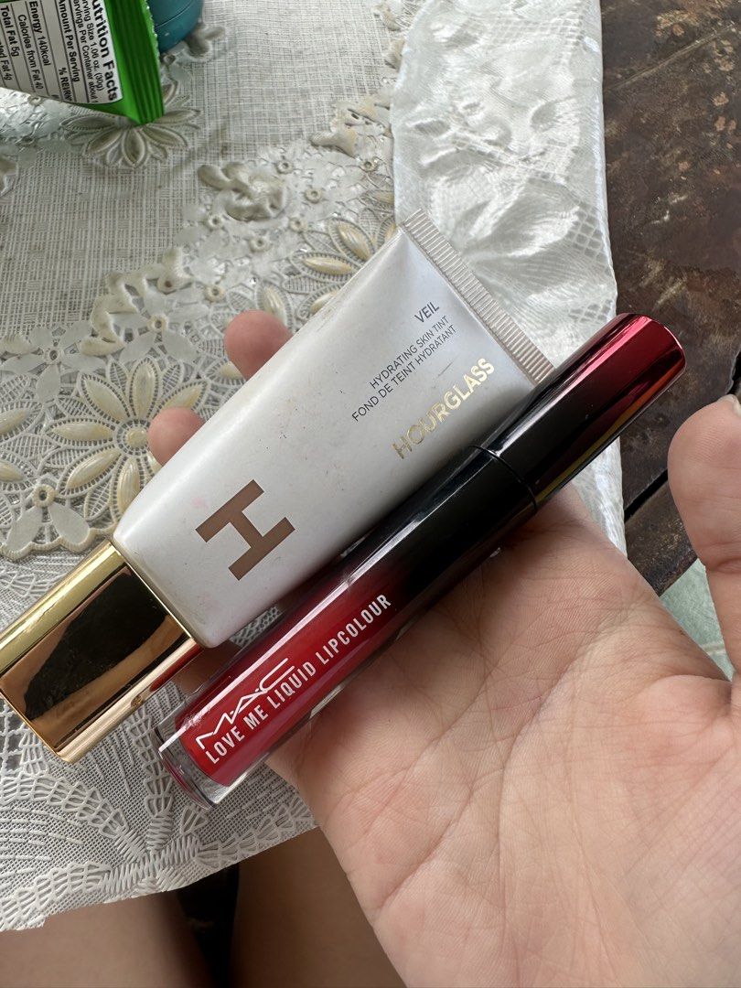 Hourglass Veil Hydrating Skin Tint & MAC Ruby Woo Lipcolour (Category: Makeup) located in Cebu City. Submitted by rzaee (Listing ID 1440235681, Image 1). Description: - Bundle includes Hourglass Veil Hydrating Skin Tint and MAC Love Me Liquid Lipcolour in Ruby Woo. - Hourglass Veil Hydrating Skin Tint: Hydrating formula for a dewy finish. - MAC Love Me Liquid Lipcolour: Vibrant, iconic Ruby Woo red shade. - Both products are full-sized. Not used,