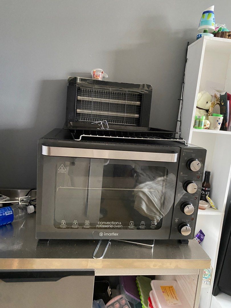 Imarflex Convection & Rotisserie Oven (Category: Ovens & Toasters) located in Manila. Submitted by katerinooo (Listing ID 1440295956, Image 1). Description: - Imarflex Convection and Rotisserie Oven - Sleek black exterior with stainless steel accents - Integrated top toaster rack - Versatile controls for temperature and function - Ideal for baking, roasting, and toasting - Compact design, perfect for small kitchens or dorm rooms.