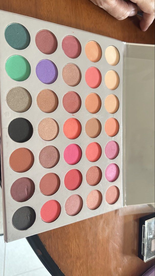 Jaclyn Hill x Sunisa eyeshadow palette (Category: Makeup) located in Paranaque City. Submitted by nixsscloset (Listing ID 1440233689, Image 3). Description: Hardly used but package was a bit dented.. eyeshadows all mostly unused, swatched at the most.. Jaclyn Hill with Sunisa.. summery daytime and night time eye shadow shades.. very pretty.