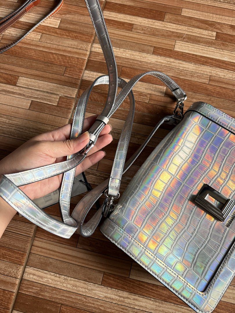 Karl Lagerfeld Paris Simone Iridescent (Category: Cross-body Bags) located in Manila. Submitted by schellane_01 (Listing ID 1440329634, Image 2). Description: Karl Lagerfeld Paris Simone Iridescent (Unused) - ₱1,000 This bag is unused but have visible signs of long-term storage such as strap deformation and edge wear. Please manage your expectations and refer to the individual photos for the actual condition..