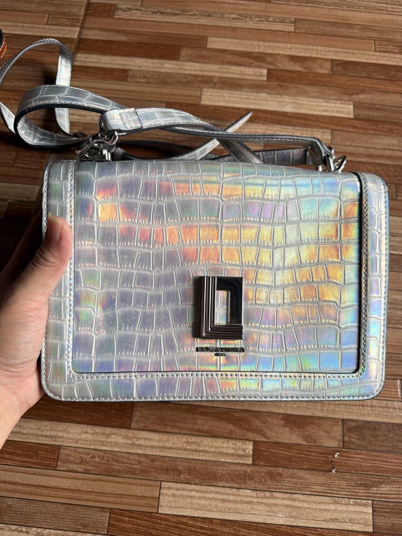 Karl Lagerfeld Paris Simone Iridescent (Category: Cross-body Bags) located in Manila. Submitted by schellane_01 (Listing ID 1440329634, Image 3). Description: Karl Lagerfeld Paris Simone Iridescent (Unused) - ₱1,000 This bag is unused but have visible signs of long-term storage such as strap deformation and edge wear. Please manage your expectations and refer to the individual photos for the actual condition..