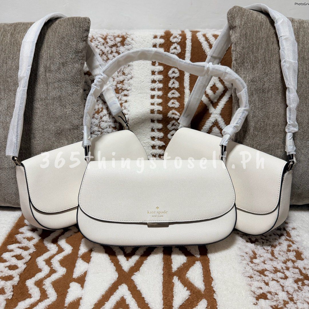 Kate Spade White Pebble Leather Shoulder Bag (Category: Shoulder Bags) located in Masantol. Submitted by 365thingstosell.ph (Listing ID 1440289634, Image 1). Description: Soooo prettyy!! 😍🥰 Avaiable now!!!! @365thingstosell.ph YES ORIGINAL 💯🫶🏻 Kasya ang long wallet mga sis Brandnew with carecard 4,800 + sf Super lightweight nya lang - Brand: Kate Spade - Material: White pebble leather - Closure: Flap with gold accent - Strap: Adjustable - In