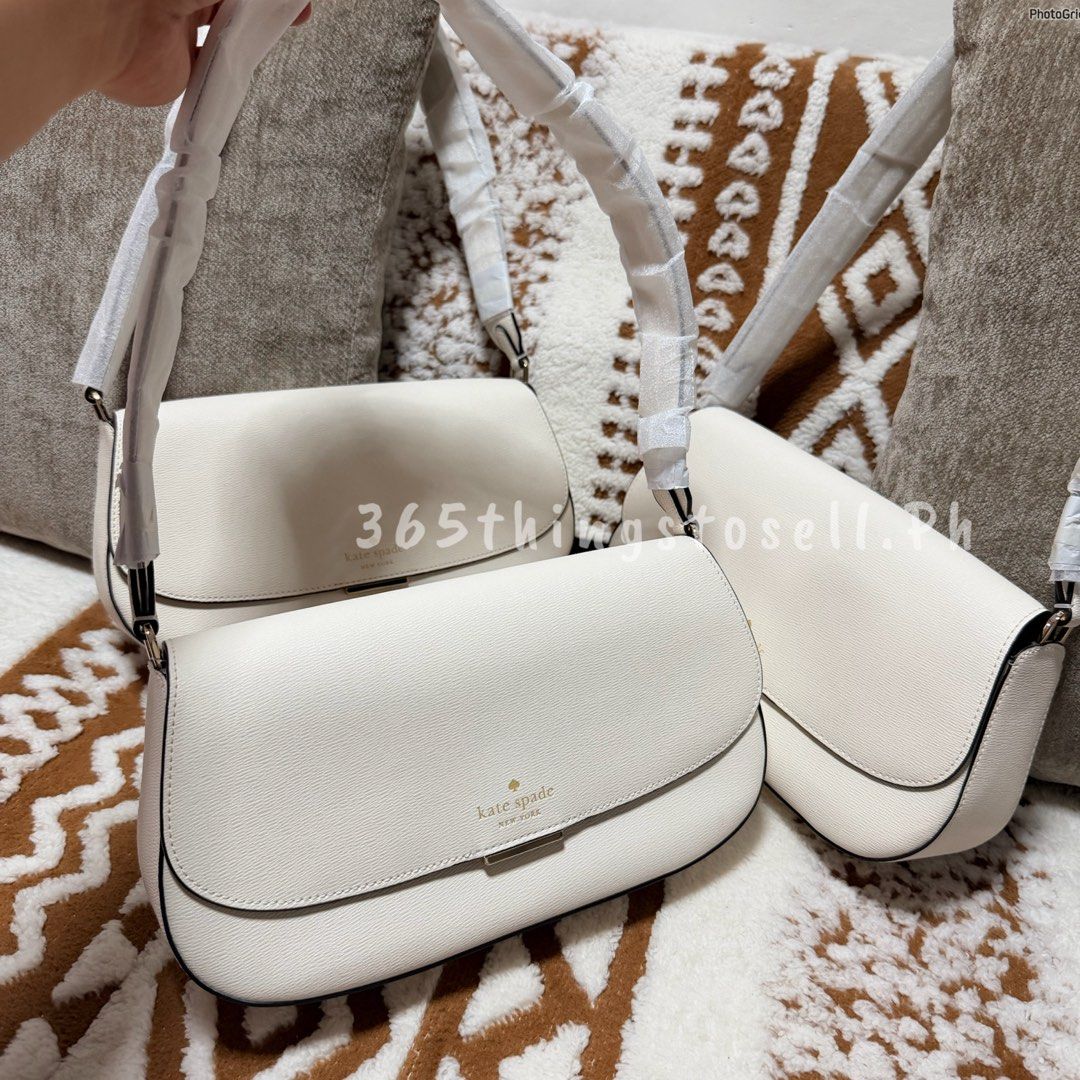 Kate Spade White Pebble Leather Shoulder Bag (Category: Shoulder Bags) located in Masantol. Submitted by 365thingstosell.ph (Listing ID 1440289634, Image 3). Description: Soooo prettyy!! 😍🥰 Avaiable now!!!! @365thingstosell.ph YES ORIGINAL 💯🫶🏻 Kasya ang long wallet mga sis Brandnew with carecard 4,800 + sf Super lightweight nya lang - Brand: Kate Spade - Material: White pebble leather - Closure: Flap with gold accent - Strap: Adjustable - In