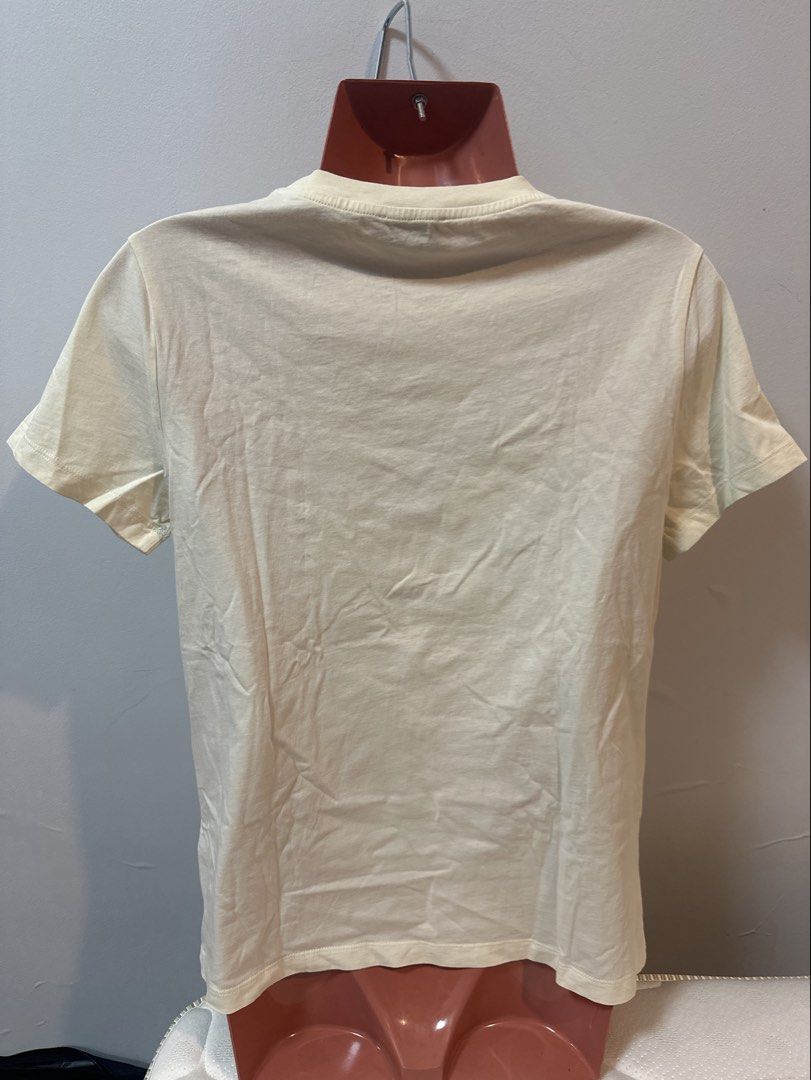 Kenzo Eye Print T-shirt (Category: Shirts) located in Las Pinas. Submitted by Mkdot (Listing ID 1439830532, Image 2). Description: - Kenzo t-shirt - Cream color - Features iconic eye print - Short sleeves - Crew neck - Size tag visible - Plain back - Everyday wear.