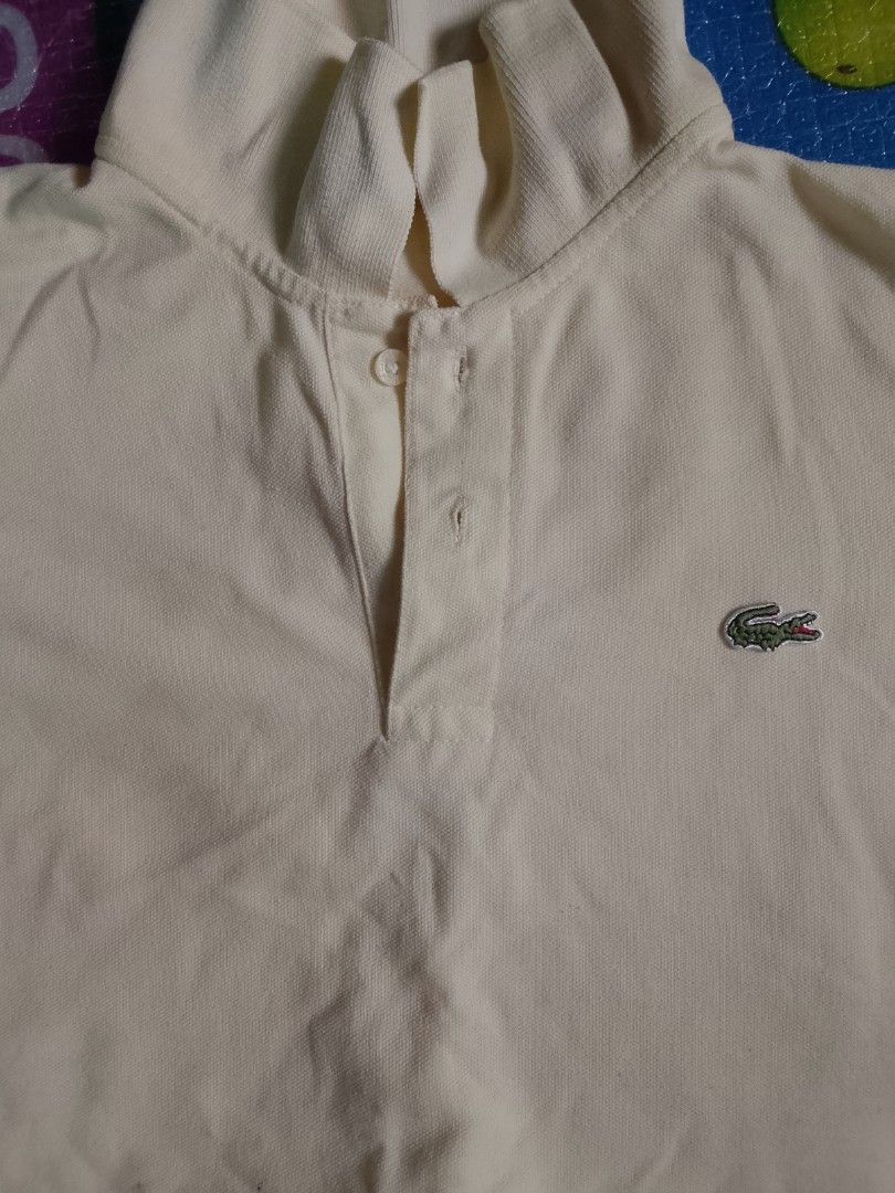 Lacoste Polo Shirt - Yellow - Size 7 (Category: Tshirts & Polo Shirts ) located in Manila. Submitted by 1111111ccas (Listing ID 1440241438, Image 2). Description: - Yellow Lacoste Polo Shirt - Made in France - Classic crocodile logo on chest - Button collar - Size 7 - Ideal for casual wear.