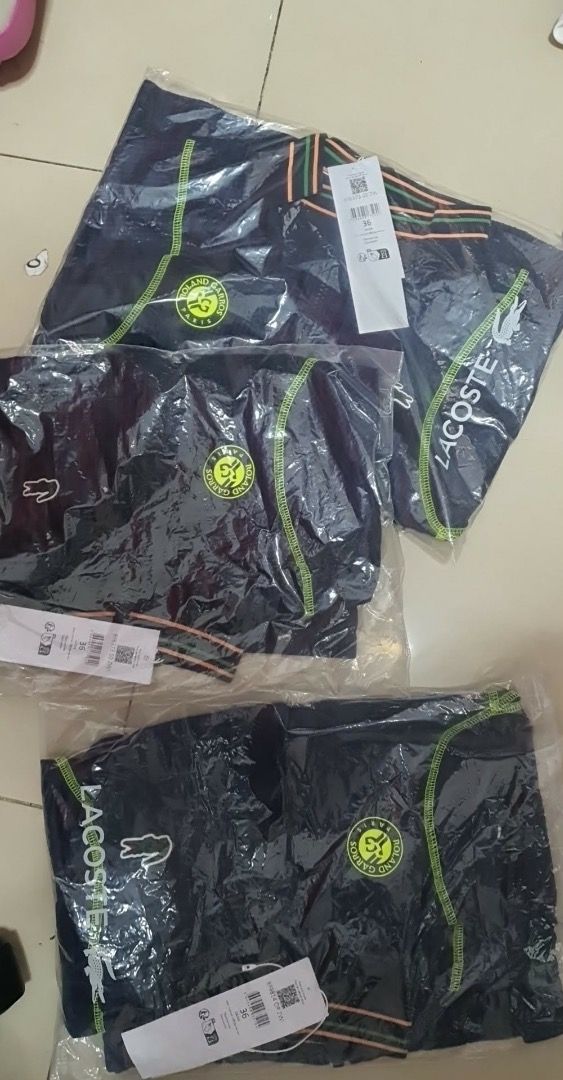 Lacoste Sport Track Jacket & Cargo Pants Set Navy Blue (Category: Coats, Jackets and Outerwear) located in Caloocan City. Submitted by rich.ell (Listing ID 1440355432, Image 2). Description: - Lacoste Sport Track Jacket & Cargo Pants Set - Color: Navy Blue with Green & Orange Accents - Jacket: Cropped style, zip-up front - Pants: Relaxed fit with cargo pockets - Ideal for casual wear or sports activities.