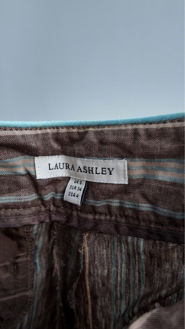 Laura Ashley Striped Wide Leg Pants (Category: Other Bottoms) located in Santa Rosa. Submitted by _jnny (Listing ID 1440289316, Image 2). Description: - Laura Ashley Wide Leg Pants - Color: Brown with thin grey and light blue stripes - Style: High-waisted - Fit: Comfortable and flowy - Versatile: Great for casual or dressed-up looks - Size: UK 8.