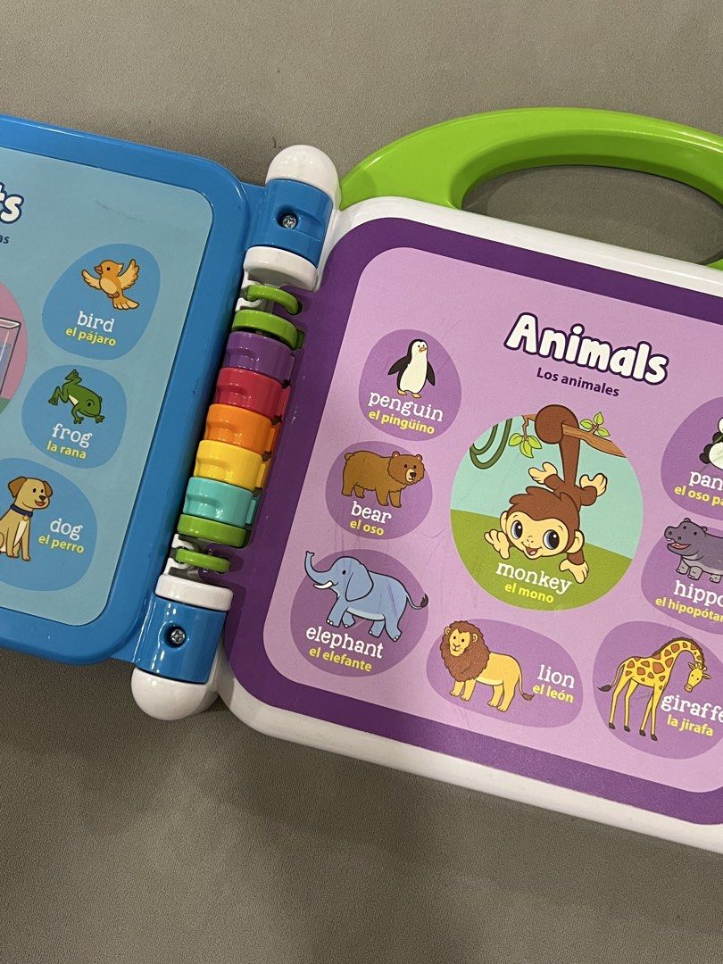 LeapFrog Learning Friends 100 Words Book (Category: Children's Books) located in Caloocan City. Submitted by thesharedit (Listing ID 1440308477, Image 3). Description: - Interactive LeapFrog learning book - Covers animals, fruits, food, and clothes - Bilingual: English and Spanish - Features fun sounds and engaging pictures - Designed for early learners - Includes a handle for easy carrying - Pages are easy for little hands to flip Have light cra