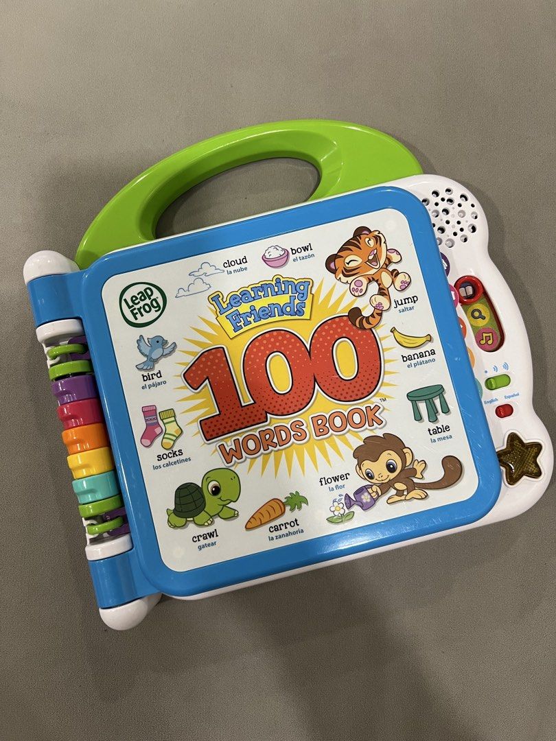 LeapFrog Learning Friends 100 Words Book (Category: Children's Books) located in Caloocan City. Submitted by thesharedit (Listing ID 1440308477, Image 1). Description: - Interactive LeapFrog learning book - Covers animals, fruits, food, and clothes - Bilingual: English and Spanish - Features fun sounds and engaging pictures - Designed for early learners - Includes a handle for easy carrying - Pages are easy for little hands to flip Have light cra
