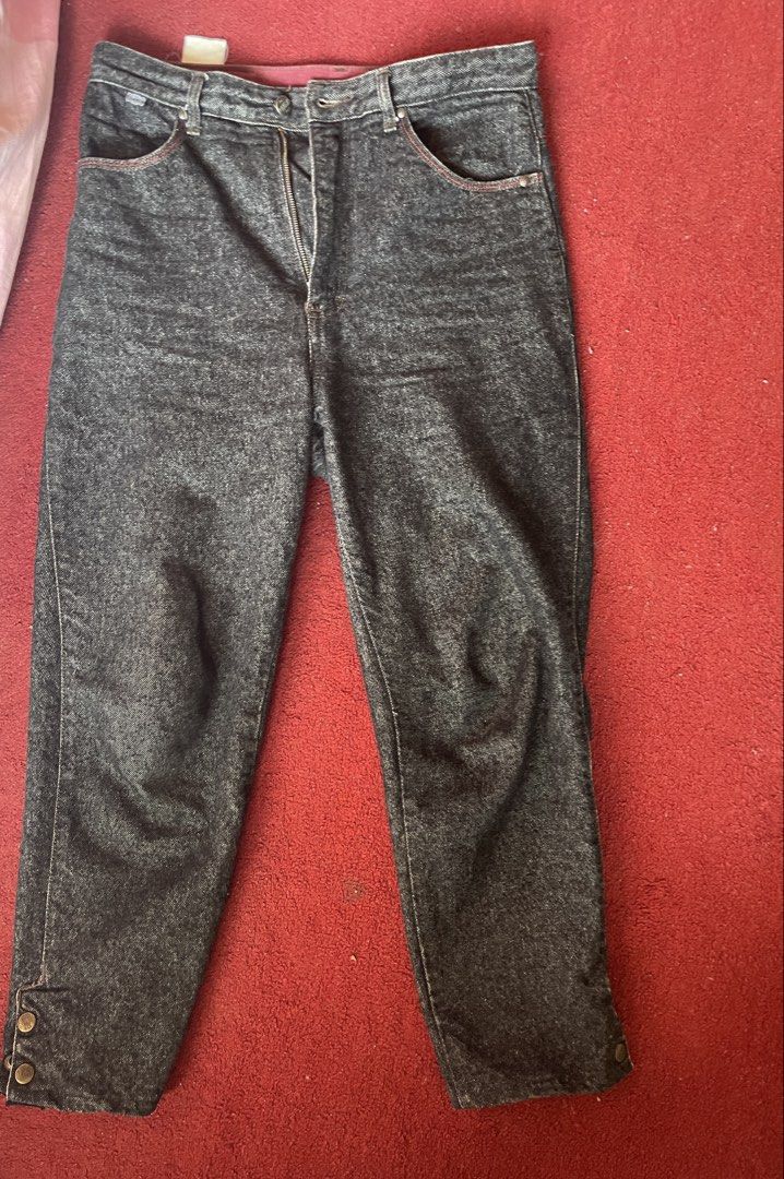 Lee x Gossip Denim Jeans (Category: Jeans) located in Toledo. Submitted by klnmia (Listing ID 1440273643, Image 2). Description: - Vintage Lee x Gossip Jeans - Dark wash denim with a unique marbled effect - Flattering high-waisted fit - Classic button fly closure - Special button details on ankle cuffs - Stylish corduroy waistband accent - Ideal for achieving a cool retro look.