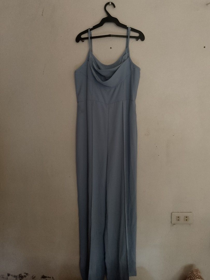 Light Blue Spaghetti Strap Wide Leg Jumpsuit (Category: Jumpsuits) located in Cavite. Submitted by everythingwonn_ (Listing ID 1440201958, Image 1). Description: - Elegant light blue jumpsuit - Spaghetti straps - Flattering cowl neckline - Comfortable wide-leg silhouette - Versatile for formal events or chic nights out - Easy to dress up or down.