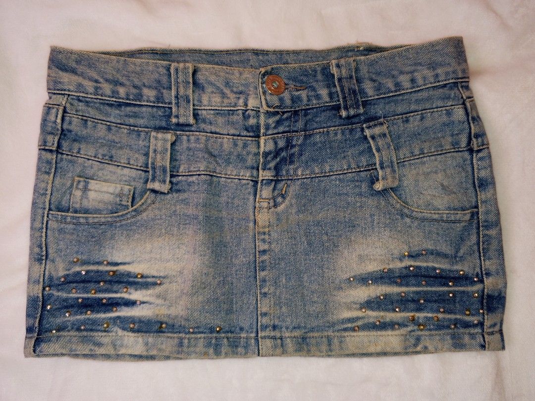 Light Wash Denim Mini Skirt with Studs (Category: Skirts) located in Manila. Submitted by aly_chy (Listing ID 1440261331, Image 1). Description: - Cute light wash denim mini skirt - Features stud detailing on front pockets and hem - Belt loops and button closure - Ideal for casual wear - Pairs well with t-shirts or cute tops.