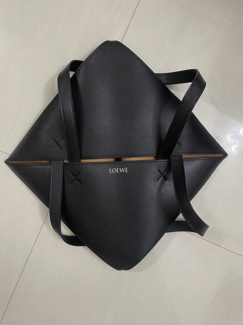 Loewe Origami Tote Bag (Category: Luxury Bags & Wallets) located in Quezon City. Submitted by sheen_calanza (Listing ID 1439504790, Image 1). Description: - Black Loewe Origami tote bag - Unique geometric design - Two top handles - Contrasting brown interior - Made of leather - Loewe logo on the front - Thrifted in japan 🇯🇵.