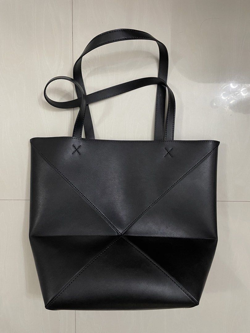 Loewe Origami Tote Bag (Category: Luxury Bags & Wallets) located in Quezon City. Submitted by sheen_calanza (Listing ID 1439504790, Image 3). Description: - Black Loewe Origami tote bag - Unique geometric design - Two top handles - Contrasting brown interior - Made of leather - Loewe logo on the front - Thrifted in japan 🇯🇵.