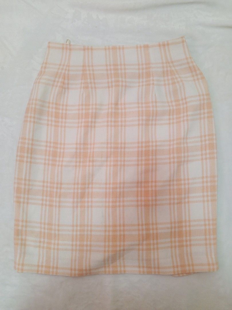 Long Skirts Bundle: Black, Plaid, and White Pleated (Category: Skirts) located in Manila. Submitted by aly_chy (Listing ID 1440262546, Image 2). Description: - Black midi skirt with 'LOVE' waistband | Free Size | Garterized - Pastel plaid mini skirt | L | Back Zipper & Garterized - White pleated midi skirt (has yellow stains) | Free Size | Garterized.