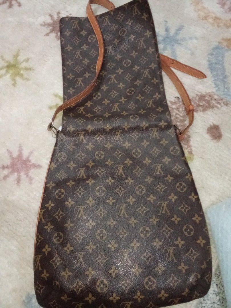 Louis Vuitton Monogram Shoulder Bag Authentic (Category: Luxury Bags & Wallets) located in Manila. Submitted by christoph17 (Listing ID 1440340417, Image 3). Description: - Classic Louis Vuitton monogram shoulder bag - Color: Brown canvas with leather trim and strap - Closure: Flap - Interior lining: Leather - Strap: Adjustable - Condition: Some signs of wear on leather strap and hardware - Overall: Great everyday bag Authentic .