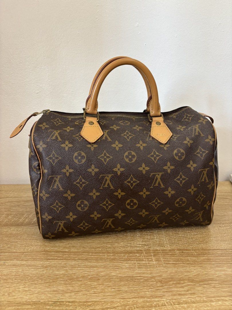 Louis Vuitton Monogram Speedy 30 Handbag (Category: Luxury Bags & Wallets) located in Cabuyao City. Submitted by HelloSunshineDeclutters (Listing ID 1440229257, Image 2). Description: Slightly Negotiable - Authentic Louis Vuitton Speedy 30 handbag - Classic Monogram canvas - Vachetta leather trim and handles - Includes dust bag and Louis Vuitton paperwork - Seldom Used - Bought from Greenbelt 4 - With dustbag and Original Receipt under my name - 