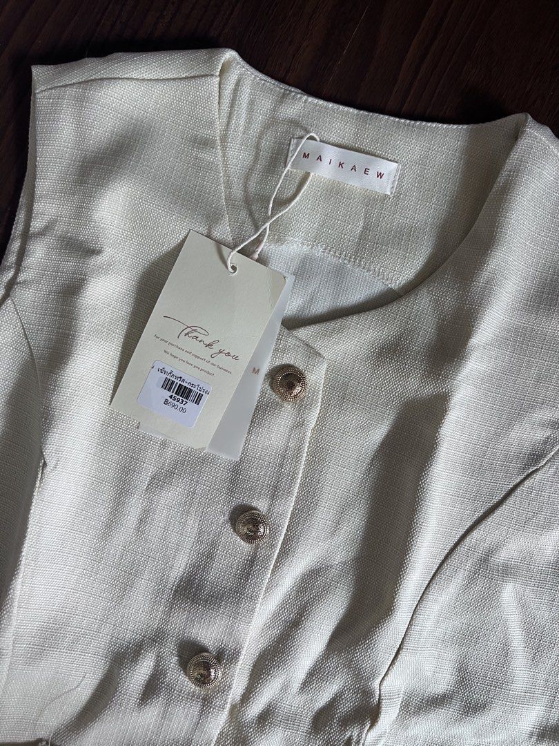 MAIKAEW Beige Sleeveless Button-Up Pleated Co ords (Category: Dresses) located in Antipolo. Submitted by riesns (Listing ID 1440346374, Image 3). Description: - Brand: MAIKAEW (From thailand) - Color: Beige - Style: Sleeveless dress - Features: Button-up front, two front pockets - Skirt: Pleated design - Condition: Brand new with original tags attached - Occasion: Smart casual.