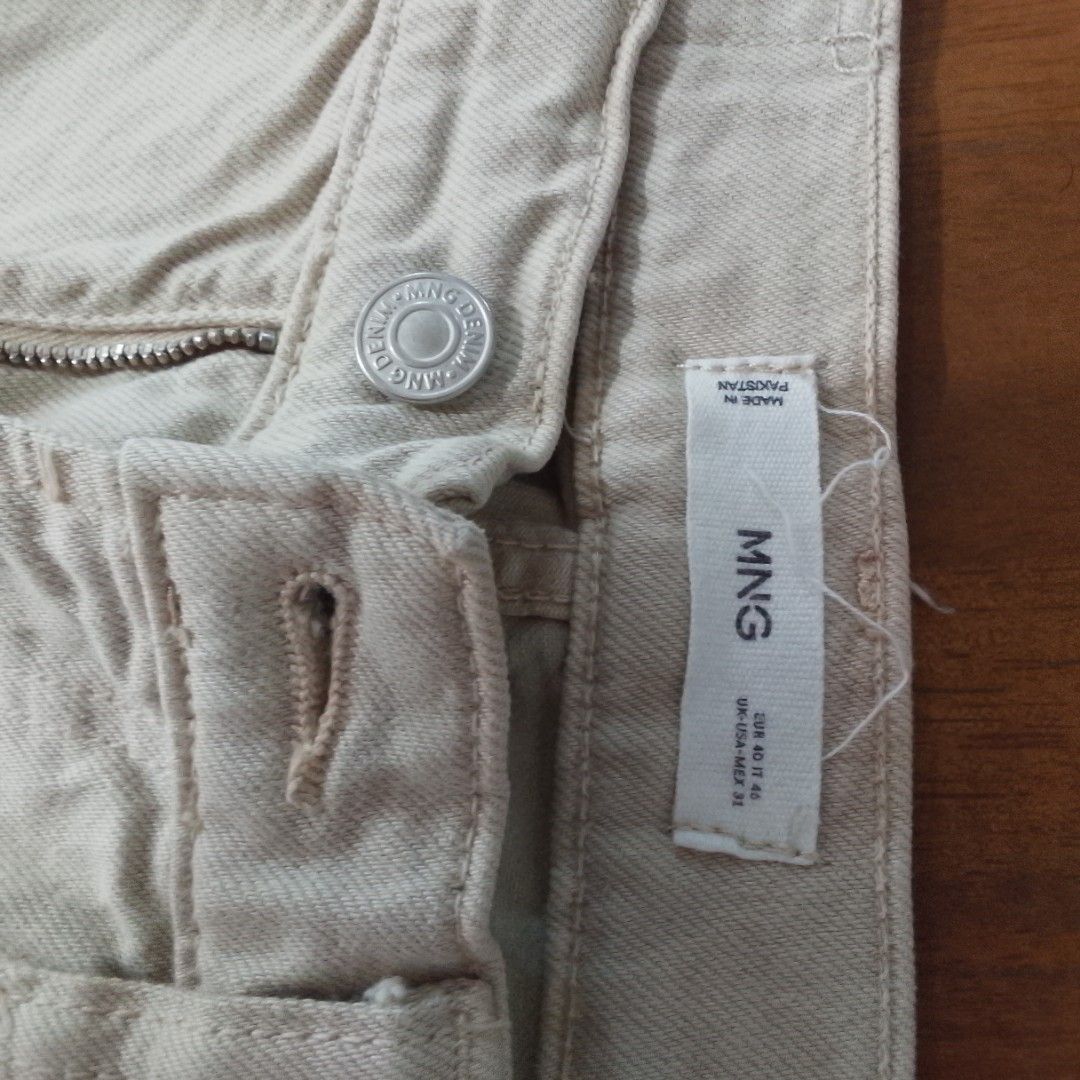 MANGO Man Beige Tapered Jeans (Size 31) (Category: Jeans) located in Manila. Submitted by jothuneatelier (Listing ID 1440274627, Image 3). Description: Up for grabs is a staple pair of ecru/beige jeans from Mango's "Ben" line. g Please note these are well-used and pre-loved, so expect normal fading and signs of wear from frequent use. However, the structure is still great, the zipper glides smoothly, and they are incredibly comfortable. Specs: Si