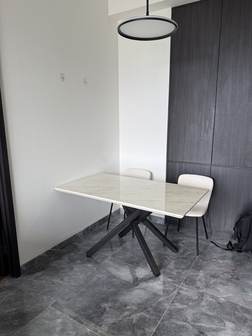 Marble Dining Table (Category: Tables & Sets) located in Singapore. Submitted by markfuszard8148 (Listing ID 1440243817, Image 2). Description: - Rectangular marble top dining table - Black metal criss-cross legs - 140cm x 80cm - Modern design - Great condition - Sits 6 comfortably - Cost over $1k new.