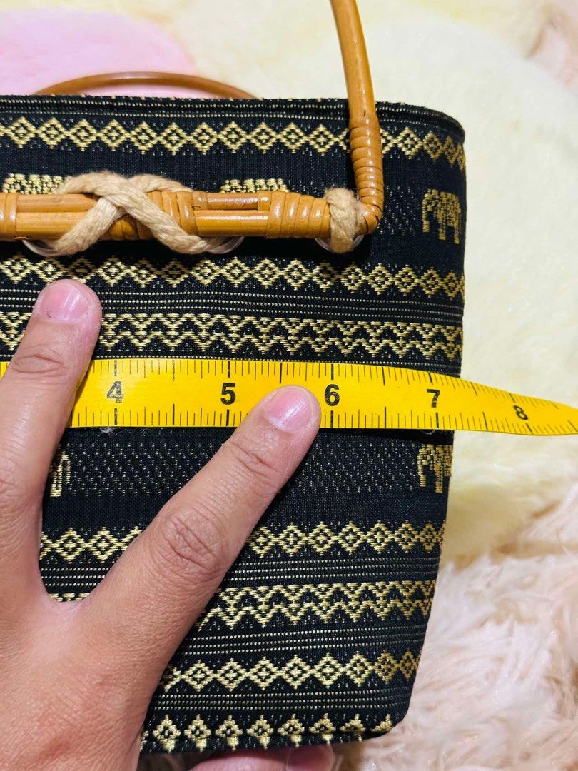 Mini Black Elephant Pattern Bamboo Handle and Handbag with Coin Pouch (Category: Luxury Bags & Wallets) located in Mandaue City. Submitted by chuchi152615 (Listing ID 1440344288, Image 3). Description: - Cute black handbag - Gold elephant and geometric patterns - Bamboo handles - Rope detail - Matching coin pouch attached - Zipper closure - Ideal for casual outings - Approximate dimensions: 6 inches tall x 5 inches wide.