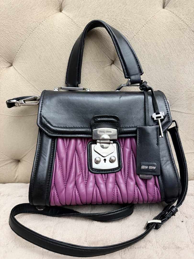 MiuMiu (Category: Luxury Bags & Wallets) located in Pasig City. Submitted by fashionalternatives (Listing ID 1440332519, Image 3). Description: Nappa Matelasse Top Handle Bag Black Soleil With sign of use. Please note this is vintage bag. Last pic for reference only In good condition.